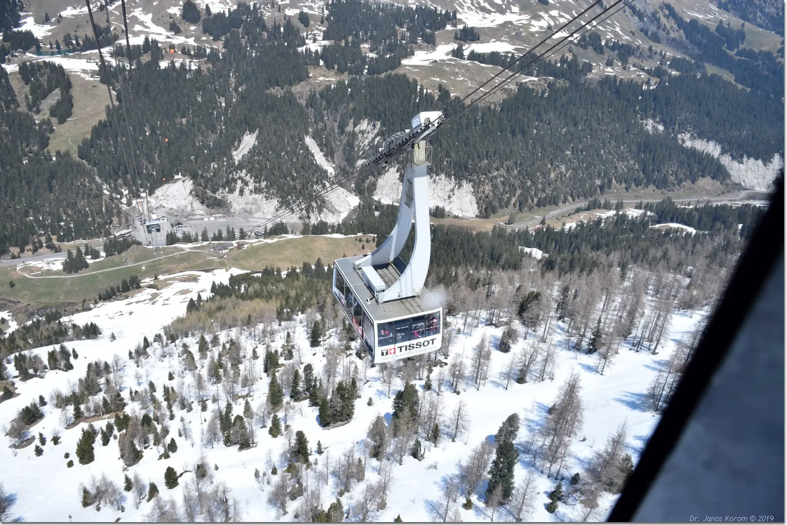 Cable car cabin above forest leaving Col du Pillon