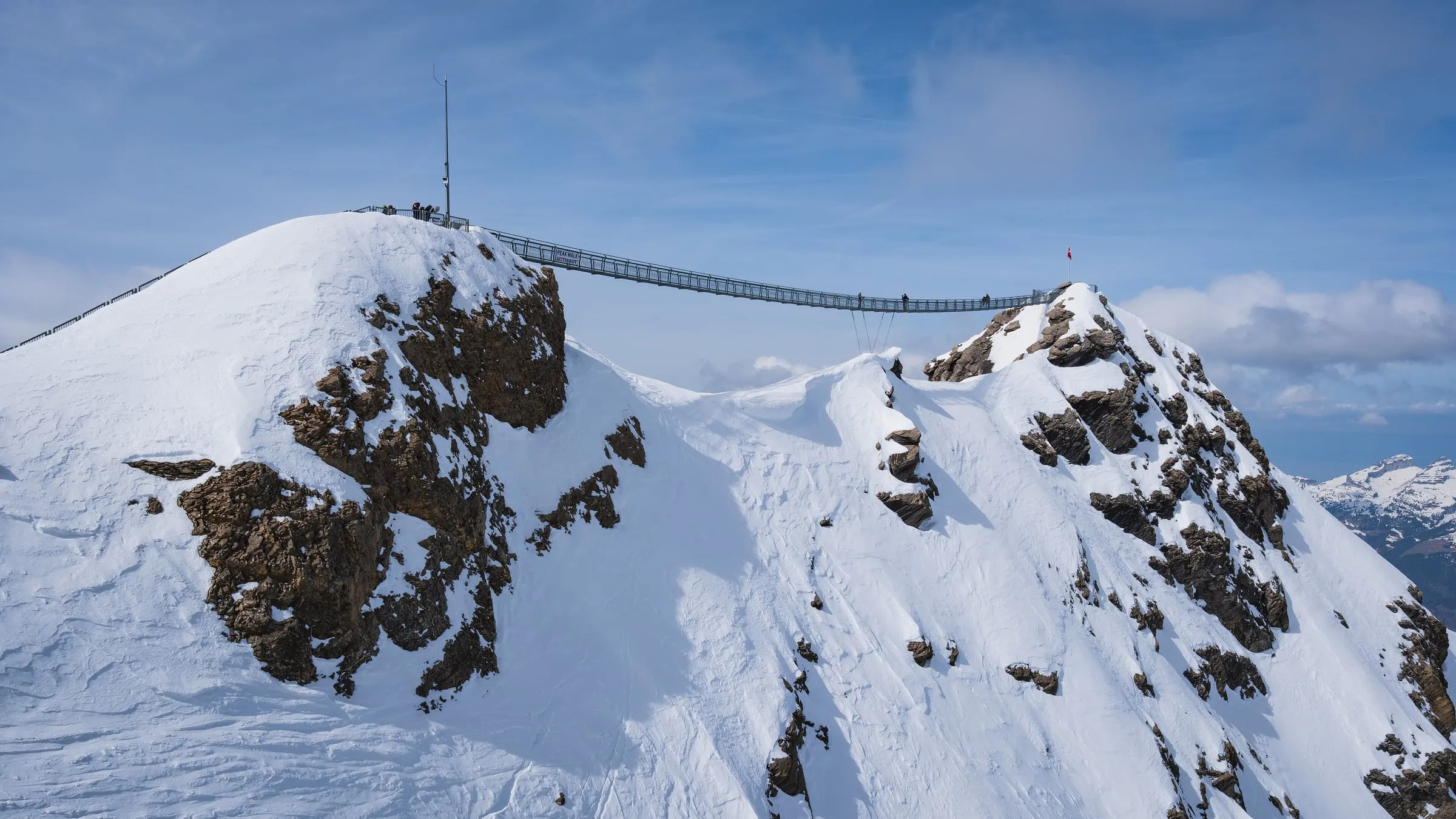 Scex Rouge summit and Peak Walk bridge in deep snow