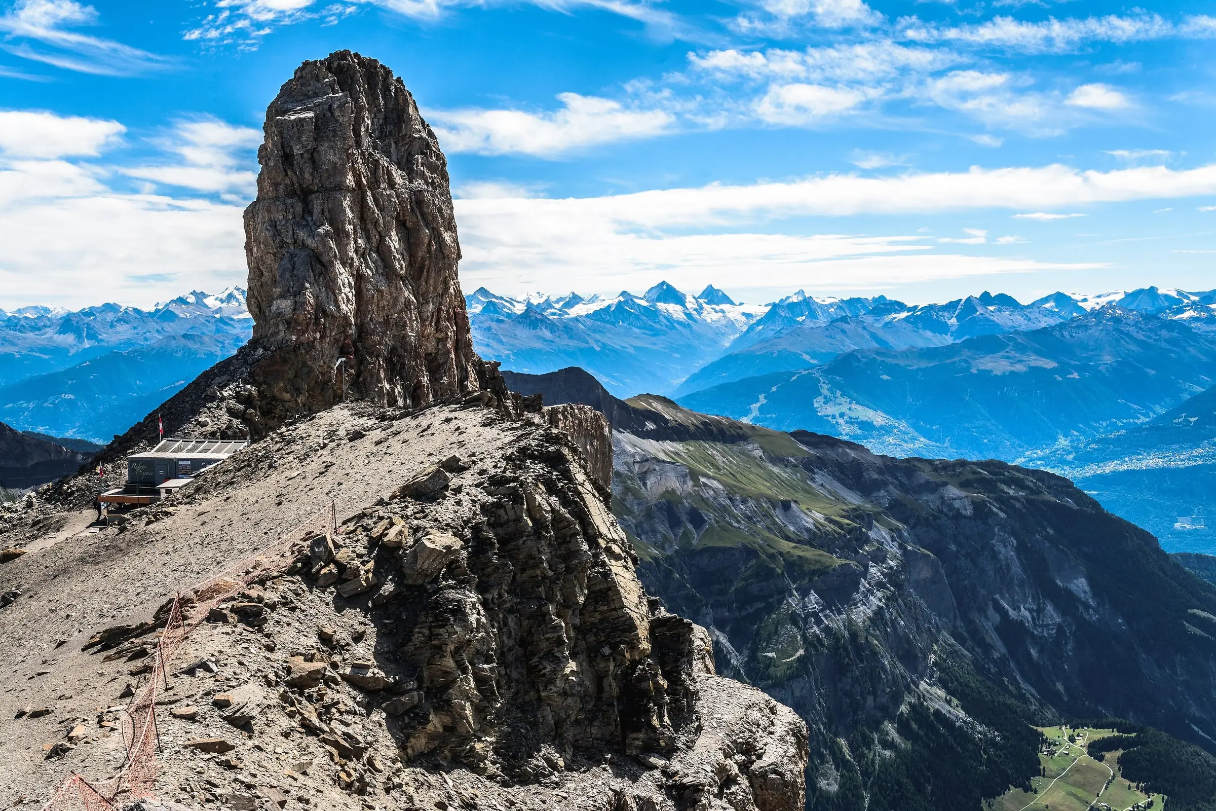 Quille du Diable rock tower against a range of Alps