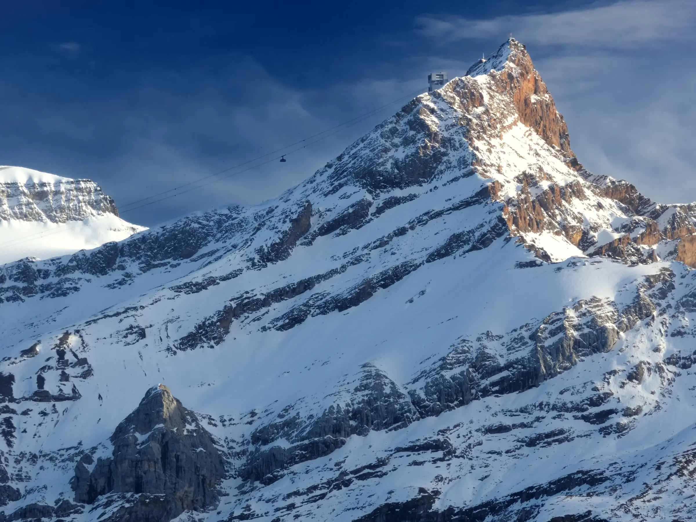 Scex Rouge rock faces glowing above snowy slopes